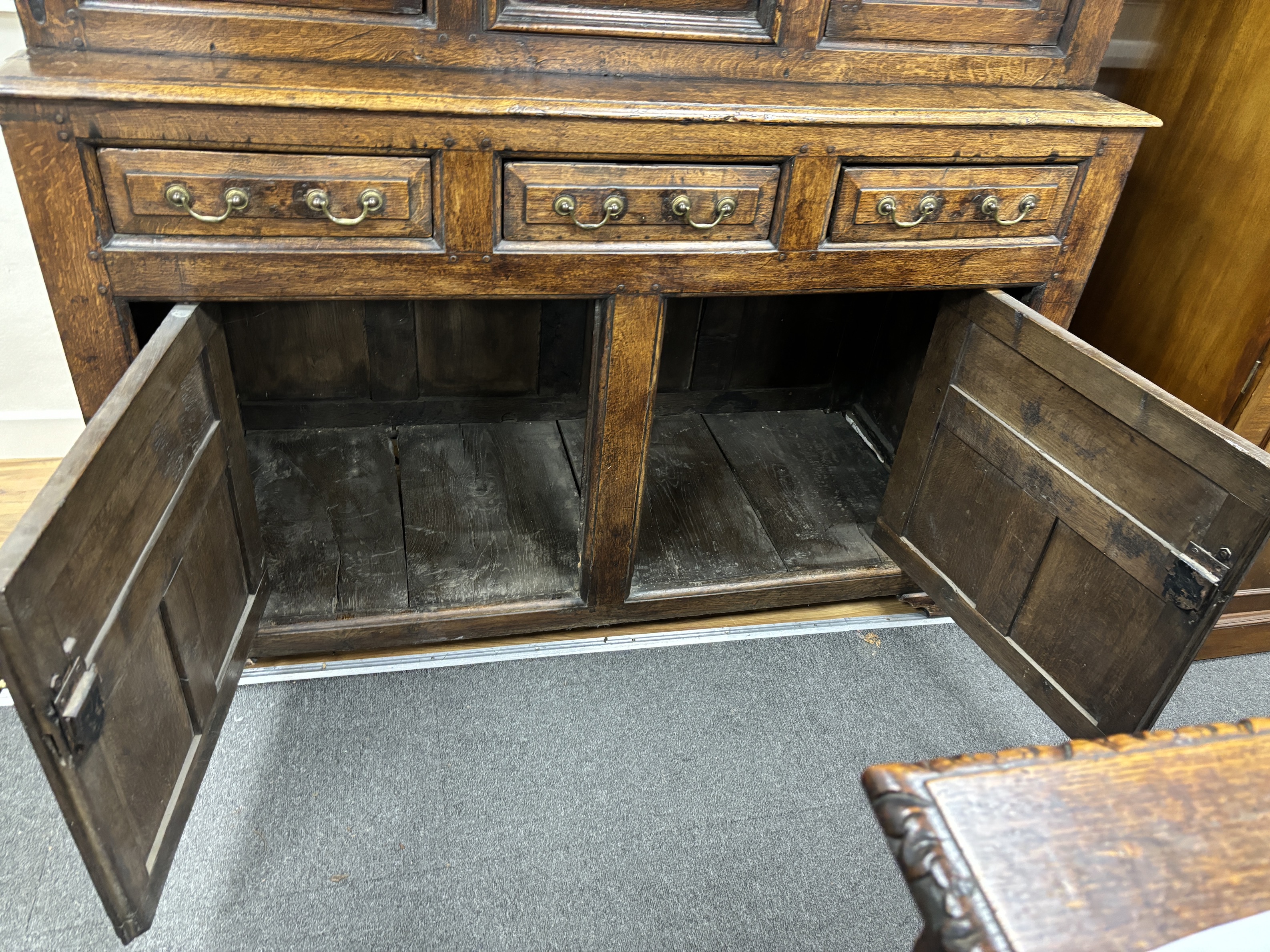 A mid 18th century Welsh oak Cwprdd Tridarn, width 136cm, depth 55cm, height 204cm